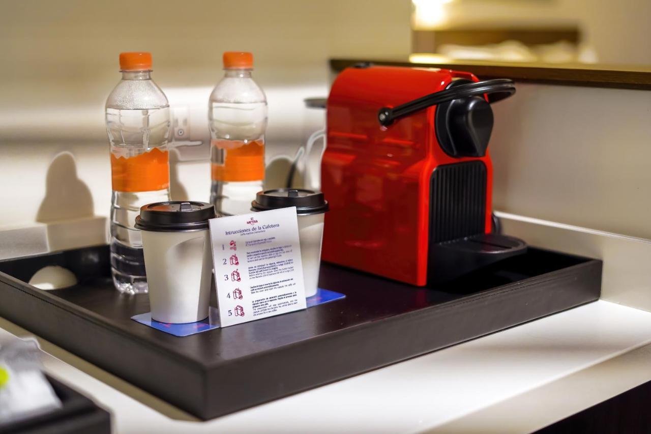 Metria Hotel Leon Exterior photo A Nespresso coffee machine in a hotel room