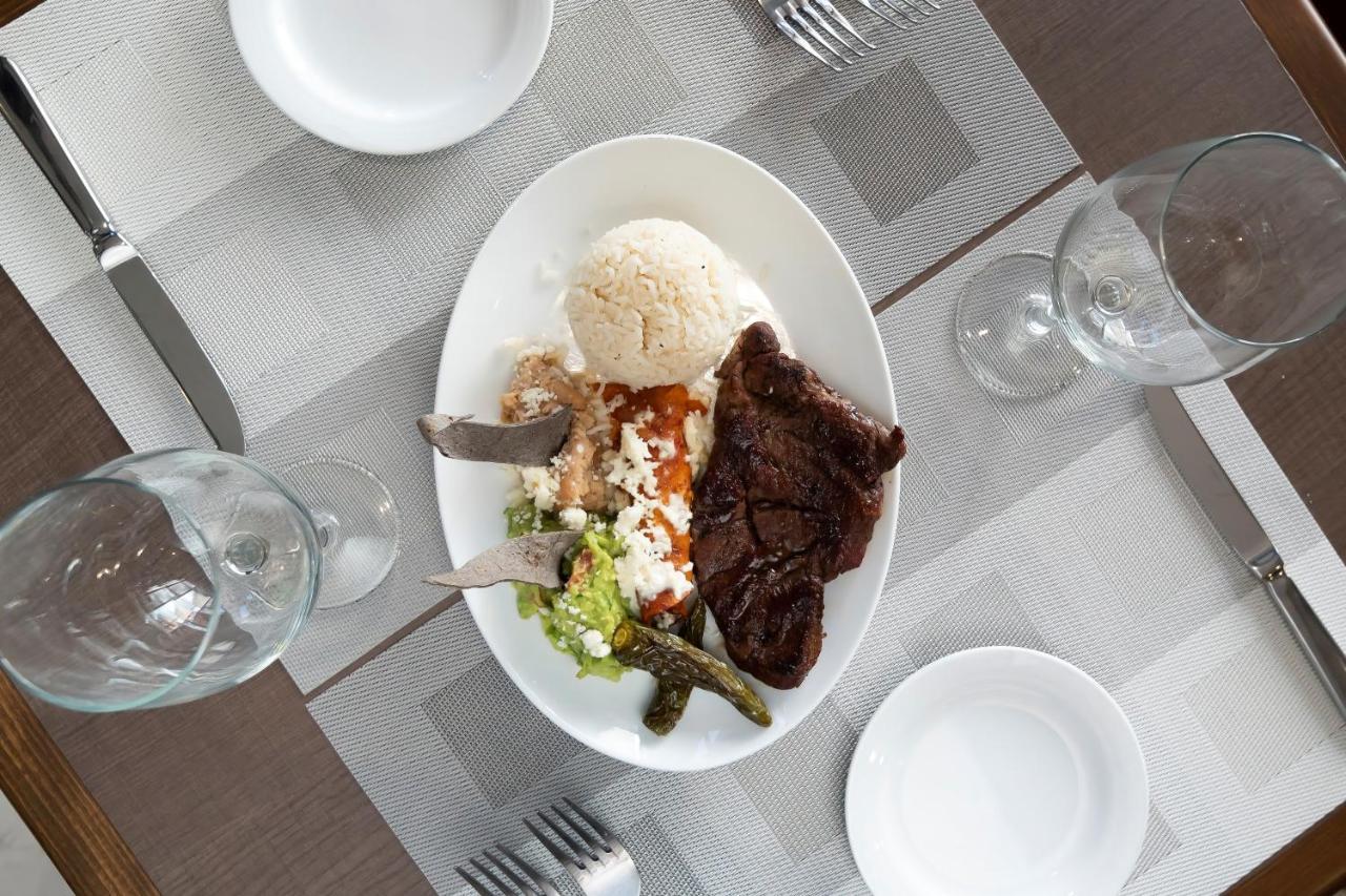Metria Hotel Leon Exterior photo A plate of Greek food